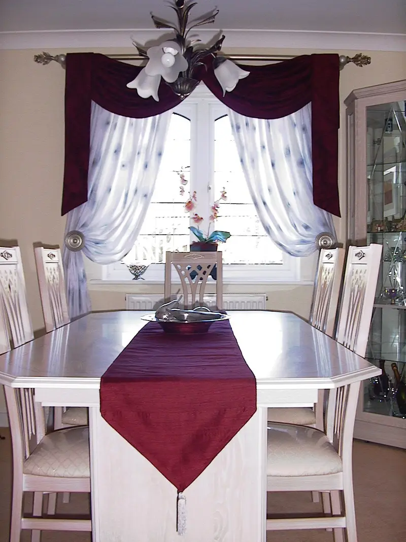 Burgundy swags in a dining room by Heather Horrocks Leigh