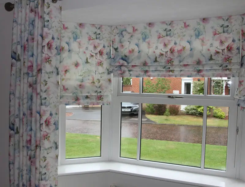 Floral Roman blinds in a bay window by Heather Horrocks Leigh