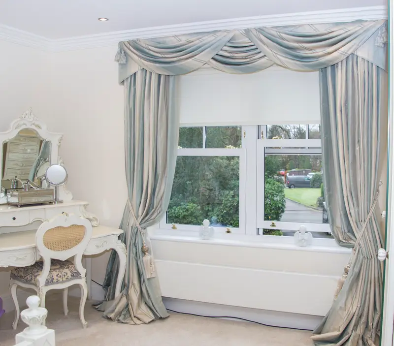 Swags and curtains over a dressing table by Heather Horrocks Leigh