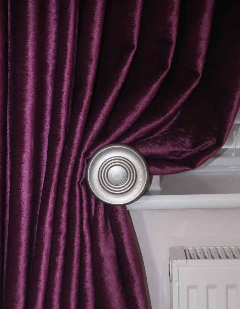 Plum velvet curtain with silver holdback by Heather Horrocks Leigh